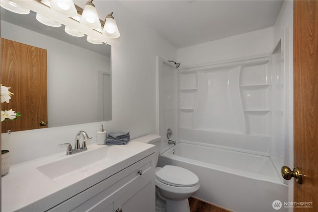 bathroom featuring shower / bathtub combination, toilet, and vanity