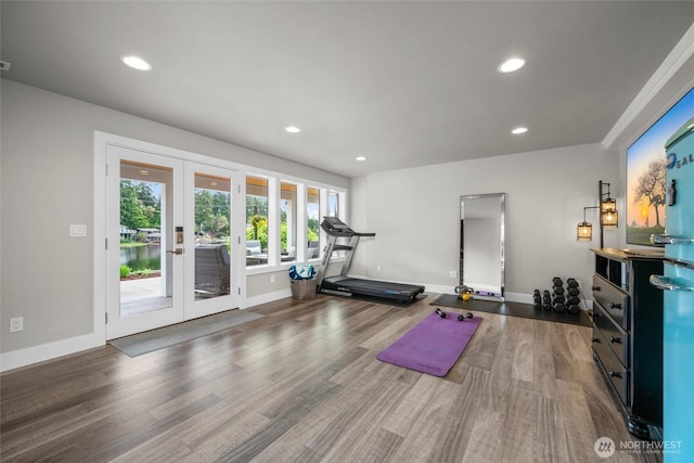 workout room with french doors, recessed lighting, baseboards, and wood finished floors