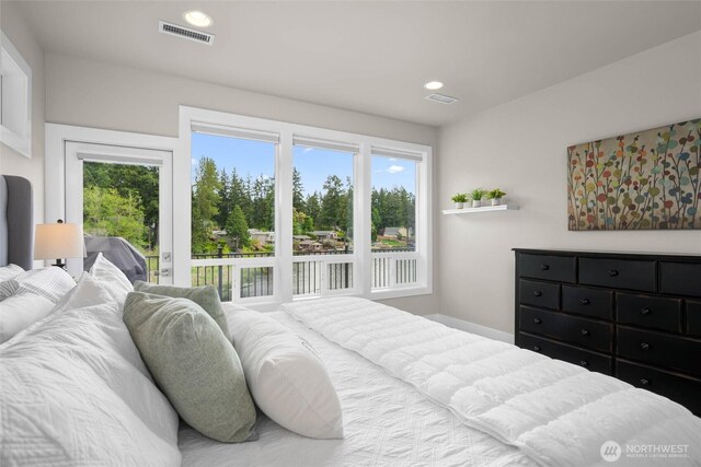 bedroom featuring multiple windows, access to outside, and recessed lighting