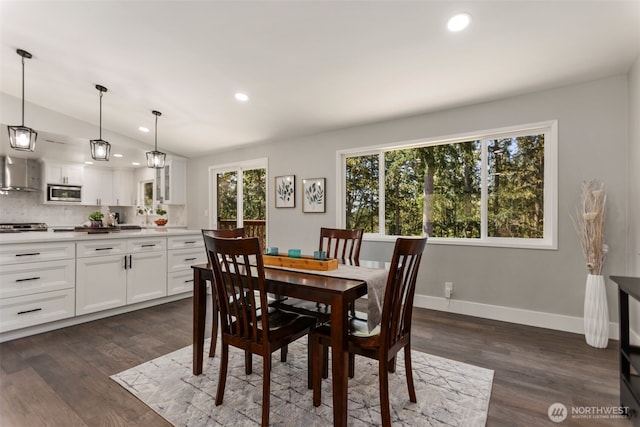 dining room featuring lofted ceiling, dark wood-style floors, and recessed lighting