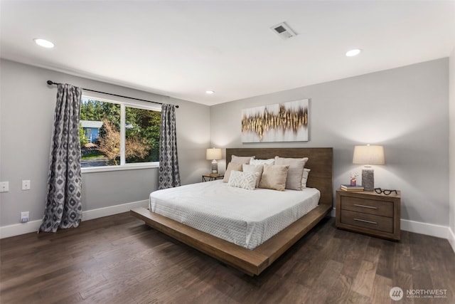bedroom with visible vents, wood finished floors, baseboards, and recessed lighting