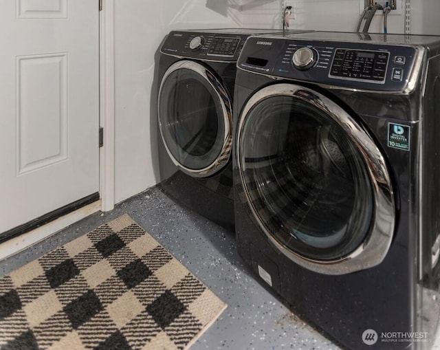 washroom with independent washer and dryer