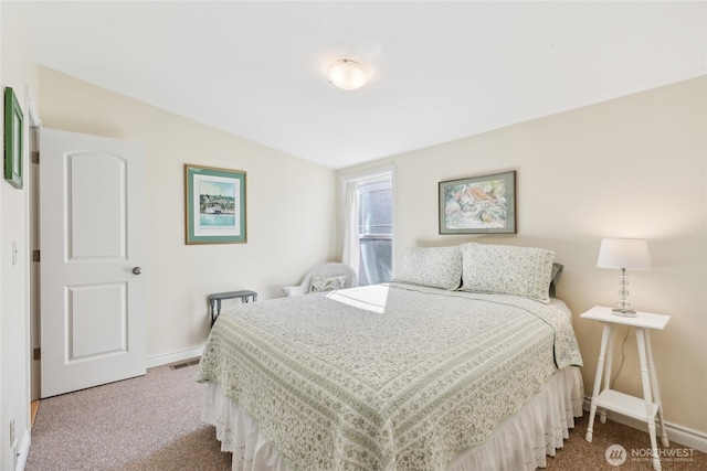 carpeted bedroom featuring baseboards and visible vents
