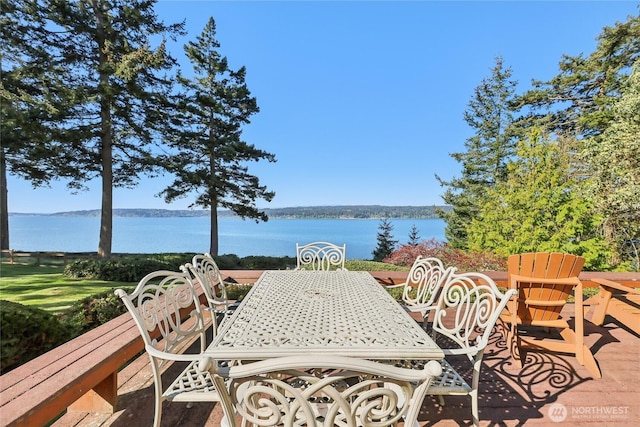 view of patio featuring outdoor dining area and a water view