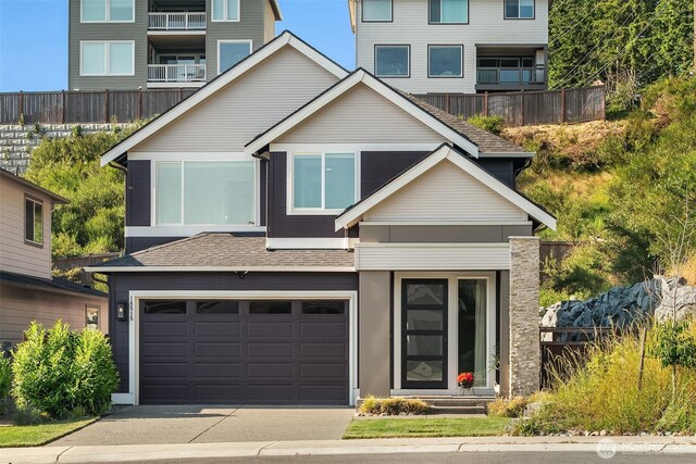 16515 26th St E, Lake Tapps, WA 98391 - modern home with an attached garage, driveway, and roof with shingles