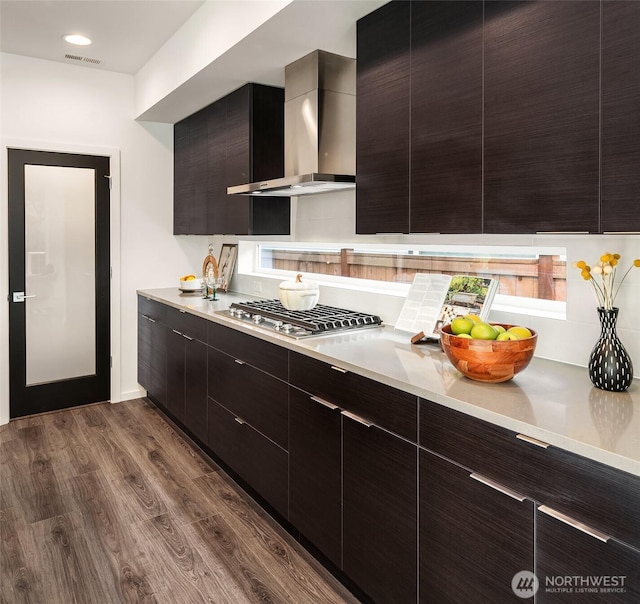 16515 26th St E, Lake Tapps, WA 98391 - kitchen featuring wall chimney exhaust hood, modern cabinets, dark wood finished floors, and stainless steel gas stovetop
