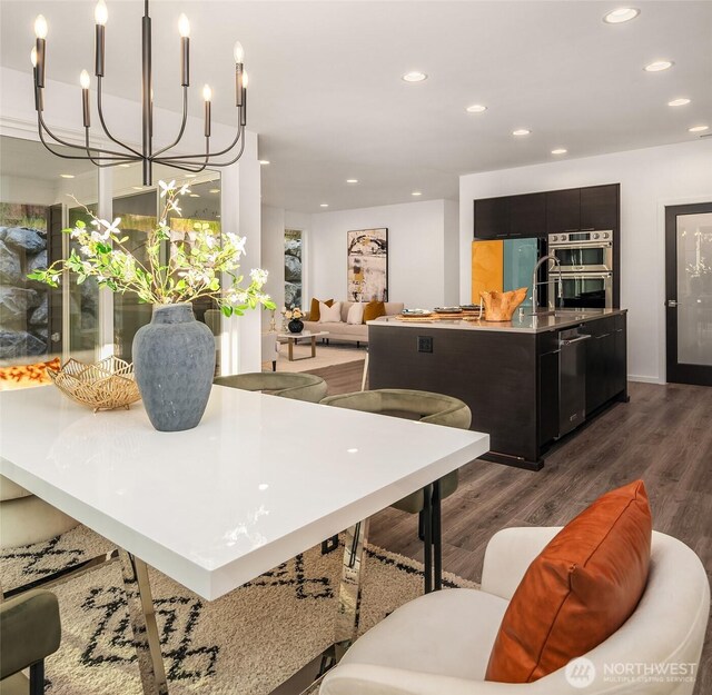 16515 26th St E, Lake Tapps, WA 98391 - dining area with dark wood-style flooring, recessed lighting, and a chandelier
