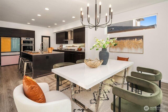 16515 26th St E, Lake Tapps, WA 98391 - dining space featuring light wood-style floors, a chandelier, and recessed lighting