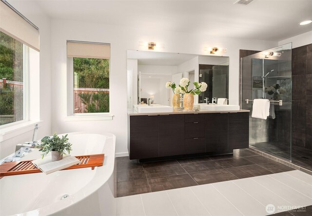 16515 26th St E, Lake Tapps, WA 98391 - bathroom with a freestanding tub, double vanity, a stall shower, and recessed lighting