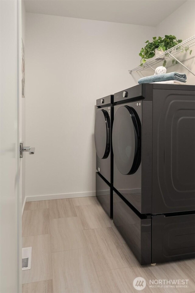 16515 26th St E, Lake Tapps, WA 98391 - laundry room with independent washer and dryer and baseboards