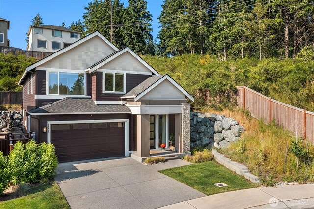 16515 26th St E, Lake Tapps, WA 98391 - view of front of house with a shingled roof, driveway, an attached garage, and covered porch