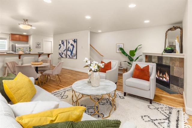 5235 11th Ave NE Unit A, Seattle, WA 98105 - living area with light wood-type flooring, recessed lighting, baseboards, and a fireplace