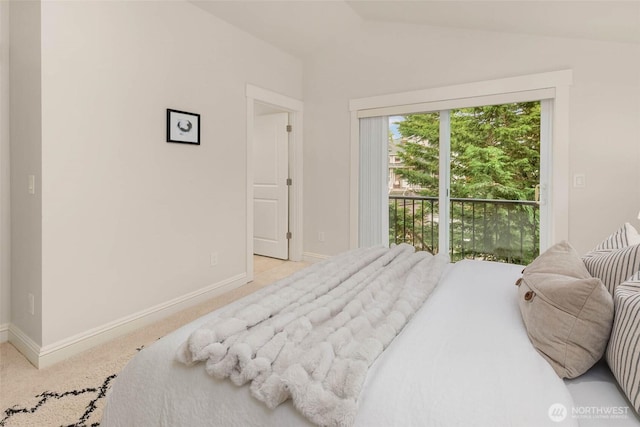 5235 11th Ave NE Unit A, Seattle, WA 98105 - carpeted bedroom with lofted ceiling and baseboards