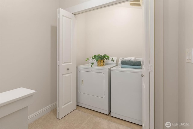 5235 11th Ave NE Unit A, Seattle, WA 98105 - laundry area featuring washing machine and dryer and baseboards