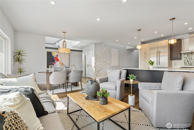 9028 45th Ave NE, Seattle, WA 98115 - living room featuring baseboards, light wood-style floors, and recessed lighting