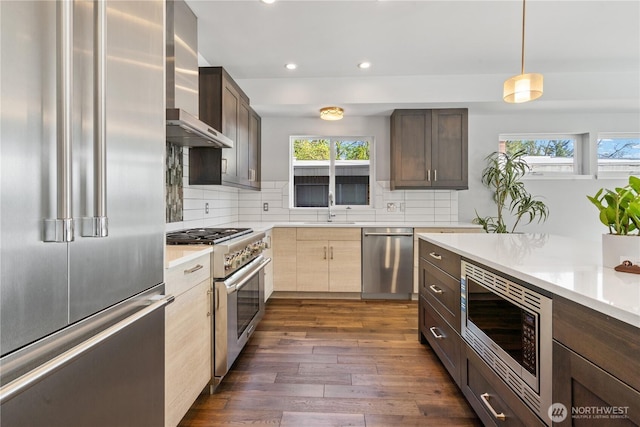 9028 45th Ave NE, Seattle, WA 98115 - kitchen with recessed lighting, plenty of natural light, a sink, wall chimney exhaust hood, and high quality appliances