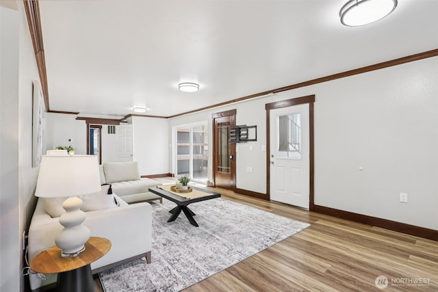 3718 NE Everett St, Camas, WA 98607 - living area featuring crown molding, wood finished floors, and baseboards