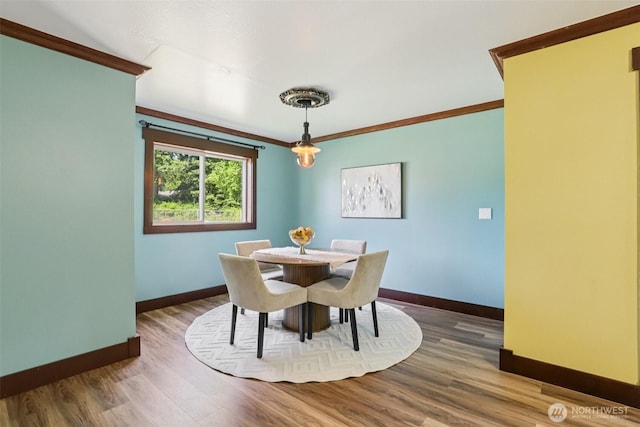 3718 NE Everett St, Camas, WA 98607 - dining space featuring baseboards, crown molding, and wood finished floors