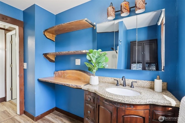 3718 NE Everett St, Camas, WA 98607 - bathroom with wood finished floors, vanity, and baseboards
