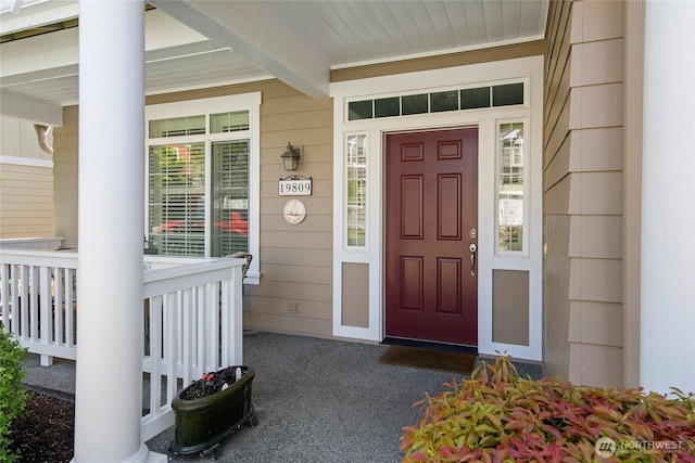 entrance to property featuring a porch