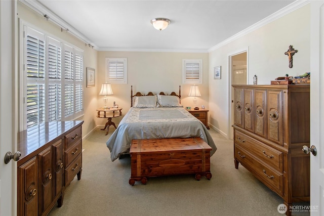 bedroom featuring crown molding, light carpet, and baseboards