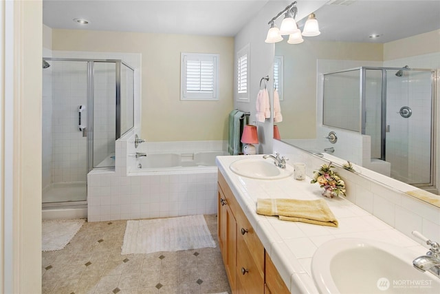 full bathroom with a shower stall, a garden tub, double vanity, and tile patterned flooring