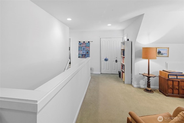 corridor with carpet flooring, baseboards, recessed lighting, and an upstairs landing