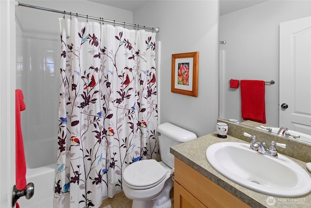 full bathroom with toilet, vanity, and shower / bath combo with shower curtain