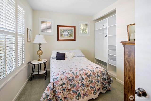 carpeted bedroom with baseboards