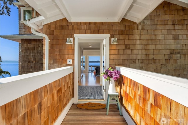 10915NE S Beach Rd, Bainbridge Island, WA 98110 - view of exterior entry with a balcony and a water view