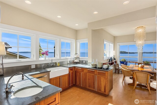 10915NE S Beach Rd, Bainbridge Island, WA 98110 - kitchen featuring a sink, brown cabinets, a chandelier, plenty of natural light, and recessed lighting