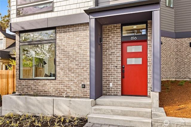 entrance to property with brick siding