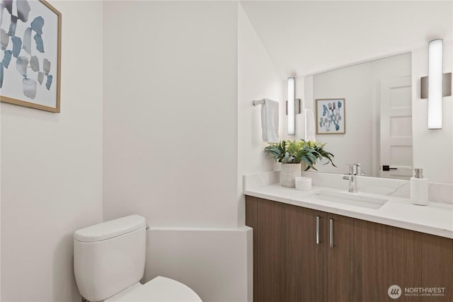 half bath with vanity and toilet