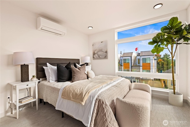 bedroom featuring baseboards, recessed lighting, and a wall mounted air conditioner