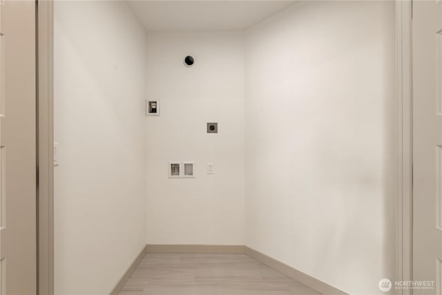 laundry room featuring laundry area, electric dryer hookup, washer hookup, and baseboards