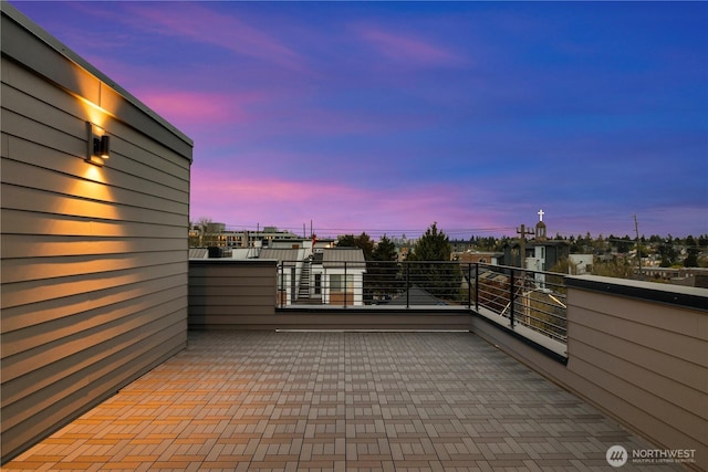 patio terrace at dusk with a balcony