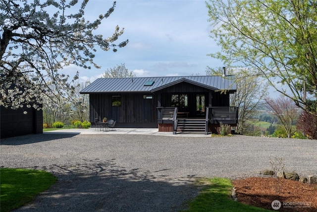 chalet / cabin featuring metal roof and a standing seam roof
