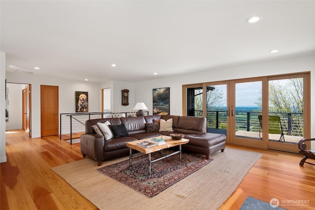 living room featuring light wood-type flooring and recessed lighting