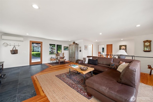 living area featuring recessed lighting and an AC wall unit