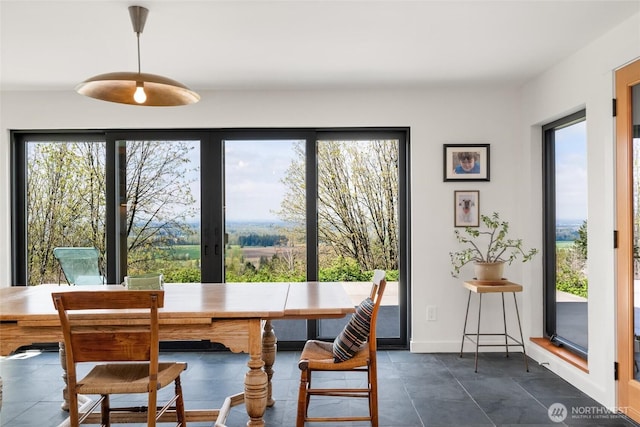 dining area with dark tile patterned floors