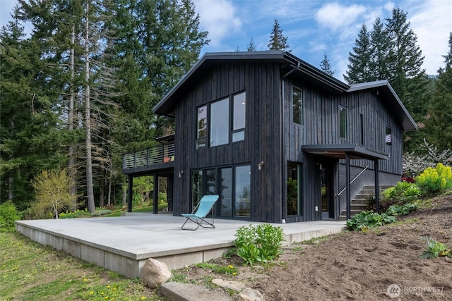rear view of property featuring a patio