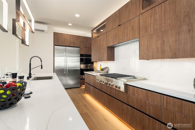 11896 SE 5th St, Bellevue, WA 98805 - kitchen featuring light wood-style floors, modern cabinets, recessed lighting, a sink, and stainless steel appliances