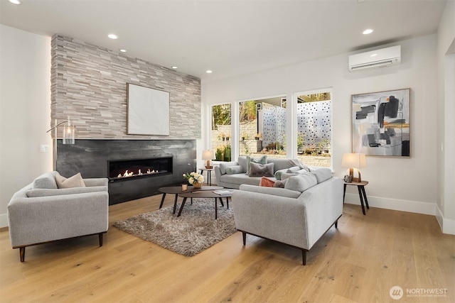 11896 SE 5th St, Bellevue, WA 98805 - living area with a fireplace, baseboards, a wall mounted AC, and recessed lighting