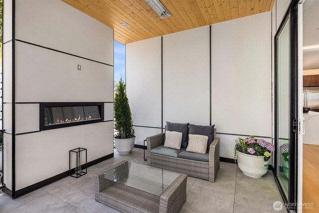 11896 SE 5th St, Bellevue, WA 98805 - interior space featuring a patio area and an outdoor living space with a fireplace