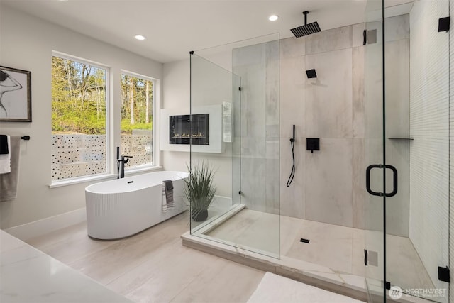 11896 SE 5th St, Bellevue, WA 98805 - full bath with a soaking tub, a shower stall, and recessed lighting