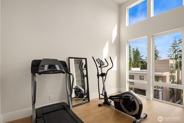 11896 SE 5th St, Bellevue, WA 98805 - workout room featuring baseboards, plenty of natural light, and wood finished floors