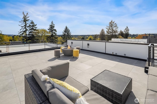 11896 SE 5th St, Bellevue, WA 98805 - view of patio with an outdoor living space with a fire pit