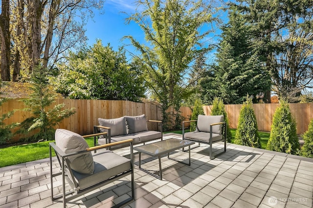 view of patio with an outdoor hangout area and a fenced backyard