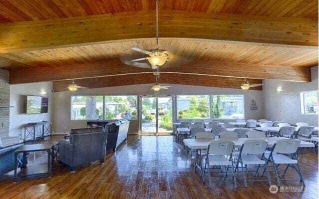 10515 60th Street Ct E Unit 165, Puyallup, WA 98372 - dining area featuring beamed ceiling, a ceiling fan, wooden ceiling, and wood finished floors