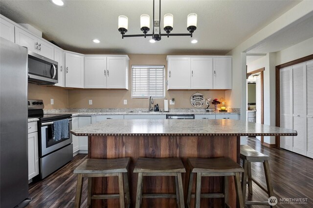 804 S Adams Ave, Warden, WA 98857 - kitchen featuring a sink, white cabinets, appliances with stainless steel finishes, and dark wood finished floors